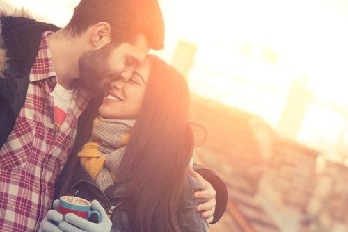 Couple hugging outside